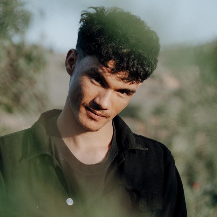 Kaveri Mehta, Lead Design Curator at Forge Garden Frame, reviewing corporate floral arrangements